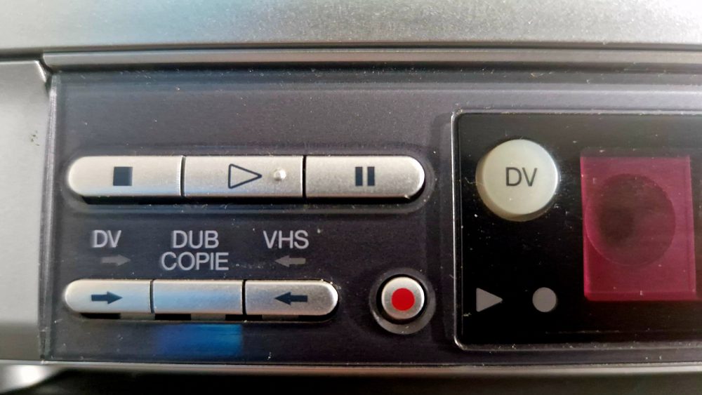 Professional tape deck controls used for consumer tape transfer, showing DV and VHS dubbing controls