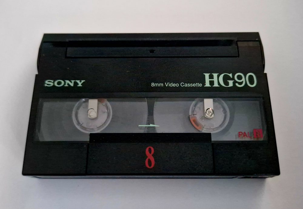 Close-up of a Sony 8mm HG90 video cassette used in tape treatment and transfer